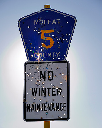 Shot up Moffat County 5 sign (2010)