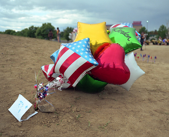 At the shrine erected for the 12 victims killed in the Aurora, Colorado movie theater shooting.
